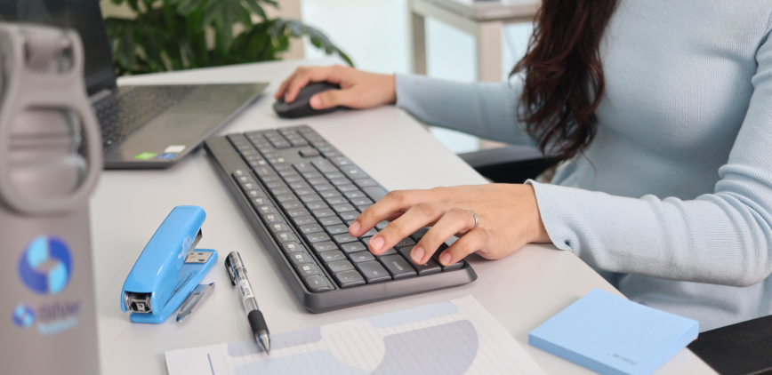 Hands typing on a keyboard